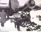 RAAF and RAF members work to load a 1000lb bomb on a Hampden