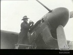 This airman of No. 456 (night fighter) Squadron RAAF at RAF Station Valley, sticks to his "diggers" slouch hat while making final adjustments to an engine of one of the squadron's MK II Beaufighter aircraft (Merlin equipped).