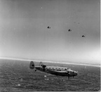 Lockheed Hudson R of 459 Sqn RAAF with its Lockheed stablemates in the form of a trio Lighnings in the background. 