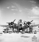 Western Desert, North Africa. c. 1943. An inspection of a Lockheed Hudson aircraft is being carried out by staff of the maintenance section of No. 459 Squadron RAAF, a Naval Co-operation Squadron, on an airfield in the Western Desert.