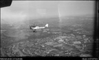 De Havilland DH 50 biplane VH-UAB in flight over Sydney, 1930 (NLA vn3723732)