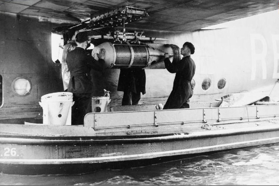 Short Sunderland 10 Squadron Loading a 450lb
                    depth charge