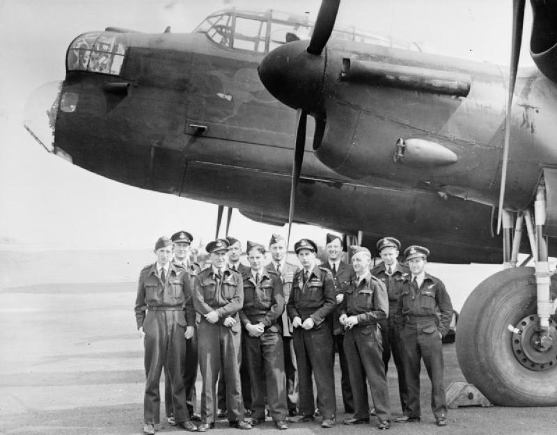 The crew of the first Lancaster to reach Australia, ED930 'Queenie', with their aircraft at Prestwick in May 1943, before setting off on its record-breaking 72 hour flight via Canada and the USA.